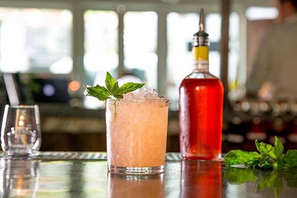 Cocktail sitting on top of a bar in the East Village.